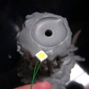 Hole drilled in the top of the hollow plastic candle.