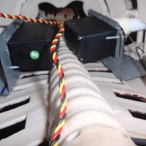 Here are the 2 servos and they are mounted to the inside back. You can see the spring on one of the servo cabling on the right.
